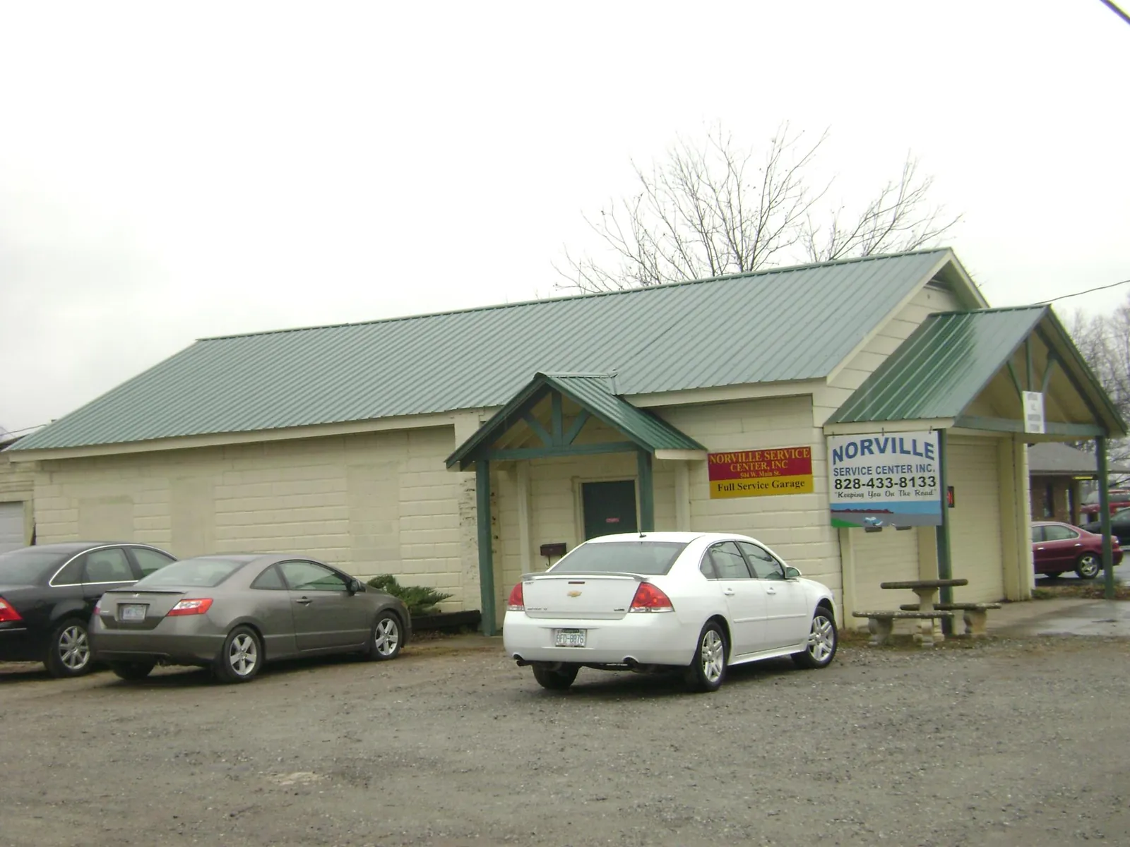 Green metal roof on a service garage with a covered entry in Mifflinburg